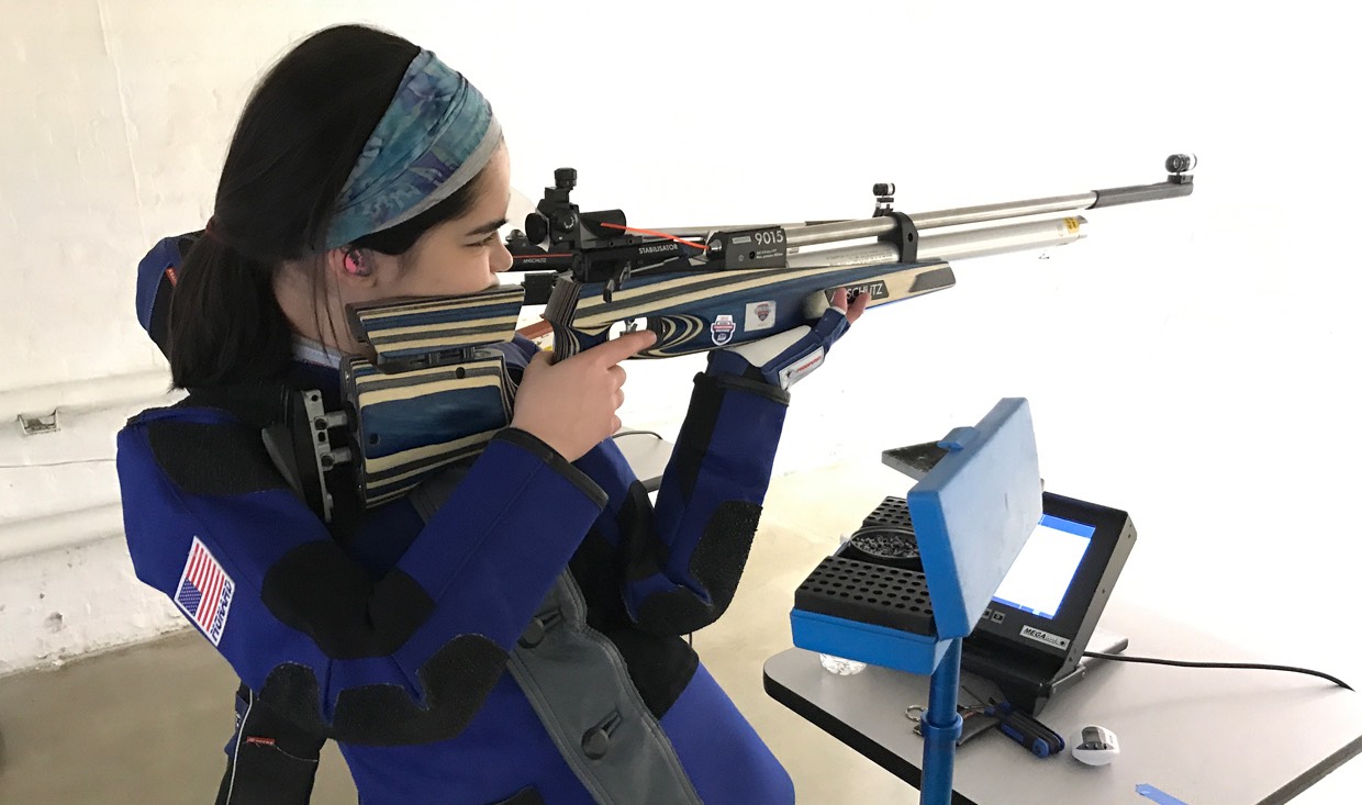 Rifle athlete, Aliah Lloyd, rests between shots in virtual competition.